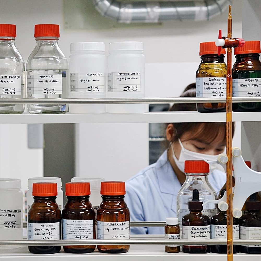 Osstem Pharma researcher developing oral care products in laboratory